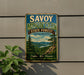 A vintage metal sign for Savoy Mountain State Forest in Massachusetts, featuring a scenic mountain landscape with pine trees and a lake.