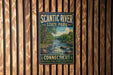A metal sign for Scantic River State Park in Connecticut, featuring a scenic illustration of a river surrounded by trees and mountains.