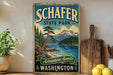 A vintage-style sign for Schafer State Park in Washington, featuring a scenic mountain landscape with pine trees and a lake.