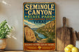 a vintage-style sign for the Seminole Canyon State Park and Historic Site in Texas, with a scenic illustration of the canyon landscape.