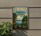 A vintage metal sign for Semolina State Park in Georgia, featuring a scenic landscape with pine trees, a lake, and mountains.