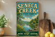 a vintage-style sign for Seneca Creek State Park in Maryland, with a scenic illustration of the park's natural surroundings. The sign is displayed on a wooden shelf, surrounded by various kitchen utensils and a potted plant.