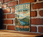 A vintage-style sign for Sequoyah State Park in Oklahoma, featuring a scenic landscape with mountains, water, and trees.