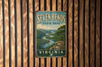 A vintage-style sign for Seven Bends State Park in Virginia, featuring a scenic landscape with a winding river and lush green forests.