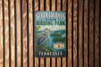 A vintage metal sign for Seven Islands State Birding Park in Tennessee, featuring a blue heron and a scenic landscape.