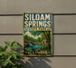A vintage-style metal sign for Siloam Springs State Park in Illinois, featuring a scenic landscape with a waterfall and a small cabin.