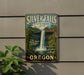 A vintage-style metal sign for Silver Falls State Park in Oregon, featuring a waterfall and forest scenery.