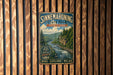 A vintage-style metal sign for Sinnemahoning State Park in Pennsylvania, featuring a scenic image of a river and forest.