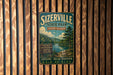 A vintage-style metal sign for Sizerville State Park in Pennsylvania, featuring a scenic image of a forest and a river.