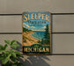 A vintage-style sign for Sleeping State Park in Michigan, featuring a scenic landscape with a beach, mountains, and pine trees.