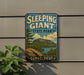 A vintage-style sign for Sleeping Giant State Park in Connecticut, featuring a scenic landscape with a mountain and lake.