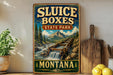 A vintage-style sign for Sluice Boxes State Park in Montana, featuring a scenic mountain landscape with a waterfall.