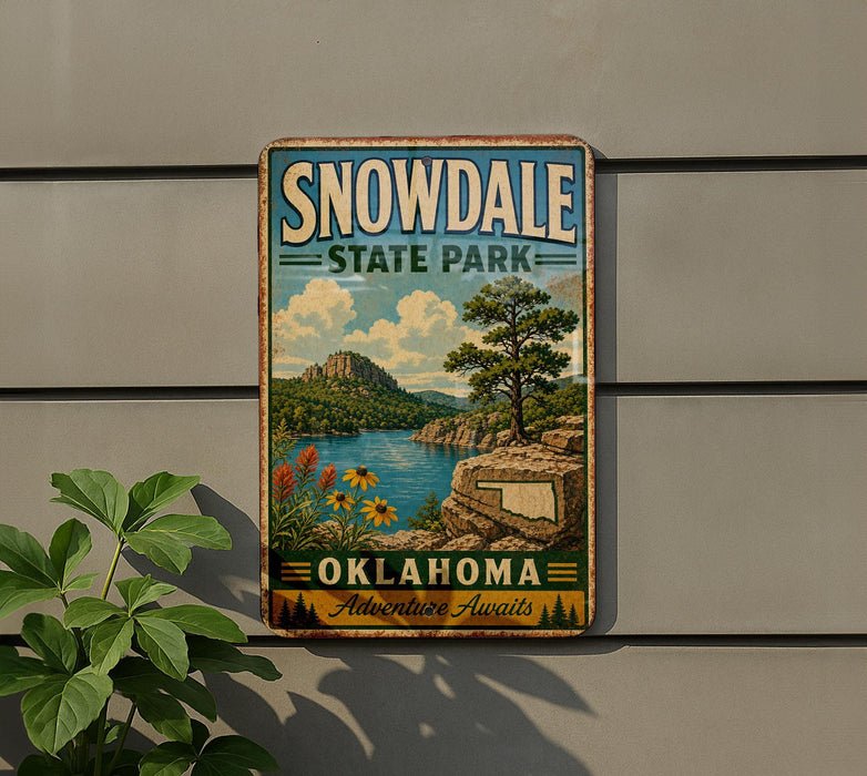 A vintage-style sign for Snowdale State Park in Oklahoma, featuring a scenic landscape with a lake, mountains, and a tree.