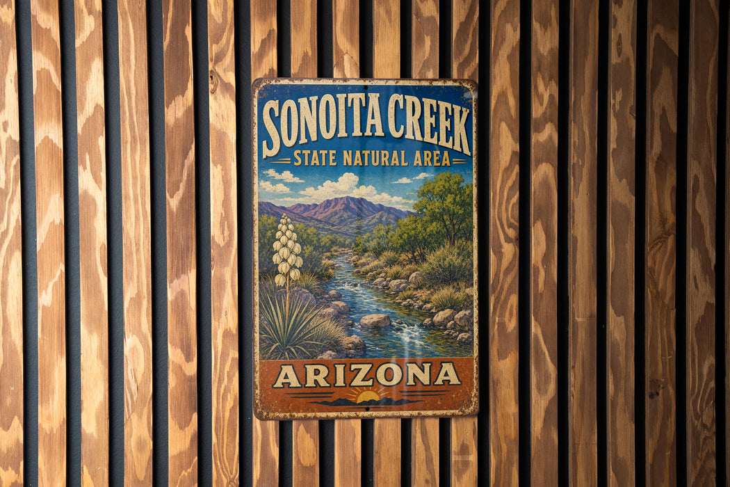 A vintage metal sign for Sonoita Creek, a state natural area in Arizona, is displayed on a wooden wall.