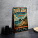 A vintage-style sign for South Beach State Park in Oregon, featuring a scenic coastal landscape with mountains, water, and beach.