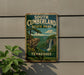A vintage-style metal sign for South Cumberland State Park in Tennessee, featuring a scenic landscape with a waterfall and a cliff.
