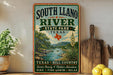 A vintage-style sign for South Llano River State Park in Texas, featuring a scenic illustration of the river surrounded by lush greenery and a desert landscape.