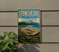 A vintage-style sign for Spencer Spit State Park, featuring a scenic landscape with a beach, mountains, and a pine forest.