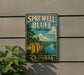 A vintage-style metal sign for Sprewell Bluff State Park in Georgia, featuring a scenic landscape with a river and cliffs.