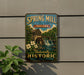 A vintage-style metal sign for Spring Mill State Park, Indiana, featuring a scenic illustration of a mill and waterfall.