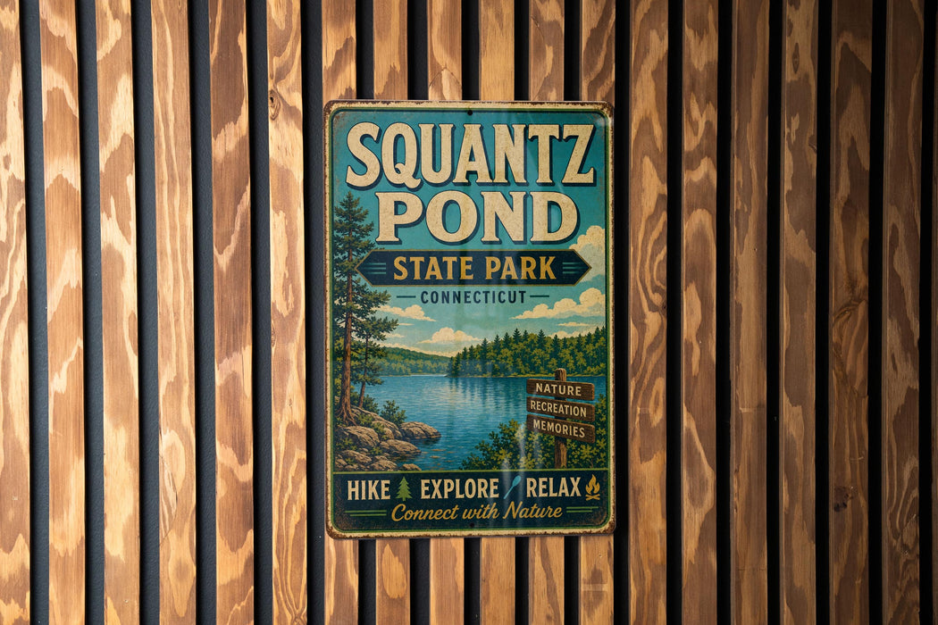 A vintage metal sign for Squantz Pond State Park in Connecticut, featuring a scenic illustration of the pond surrounded by trees and mountains.