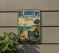 A vintage-style metal sign for St. Andrews State Park in Florida, featuring a bird, palm trees, and a beach scene.