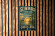 A vintage-style metal sign for St. Bernard State Park in Louisiana, featuring a seagull and a sunset landscape.