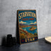 A vintage-style metal sign for Starvation State Park in Utah, featuring a scenic landscape with mountains, water, and vegetation.