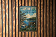 a vintage metal sign for Staunton River State Park, mounted on a wooden wall.