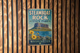 A vintage metal sign for Steamboat Rock State Park in Washington, featuring a mountain landscape and flowers.