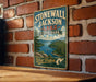 A vintage-style metal sign for Stonewall Jackson Lake State Park in West Virginia, featuring a scenic landscape with a lake and mountains.