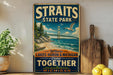 A vintage-style sign for Straits State Park, featuring a scenic illustration of the Golden Gate Bridge and the surrounding lakes, with the text "Where lakes Huron & Michigan come together MICHIGAN" prominently displayed.
