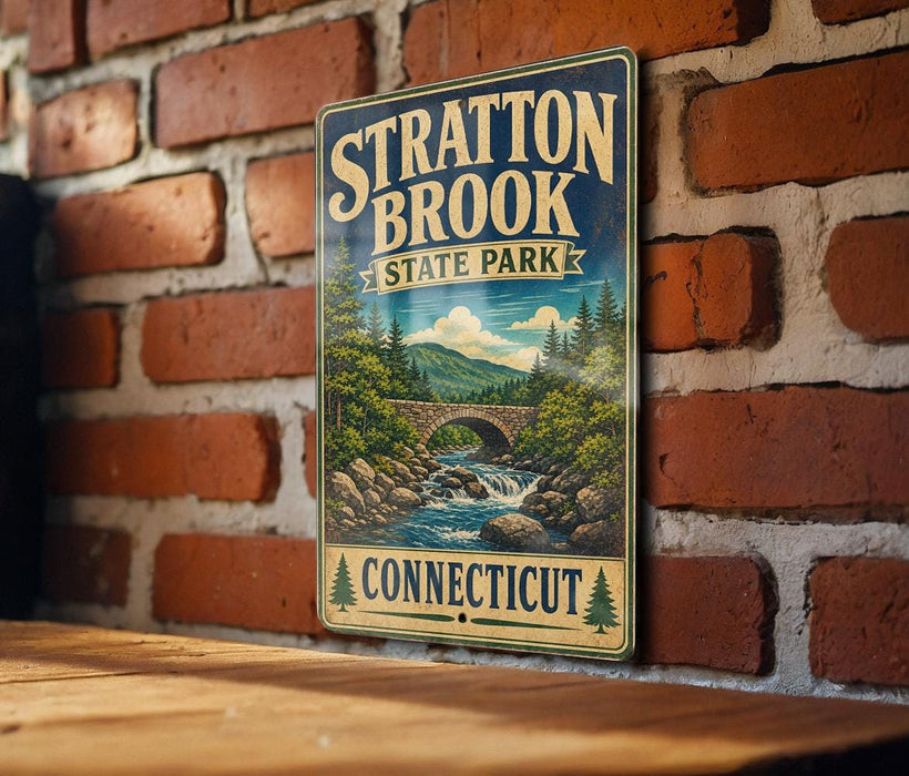 A vintage-style metal sign for Stratton Brook State Park in Connecticut, featuring a scenic illustration of a bridge and waterfall.