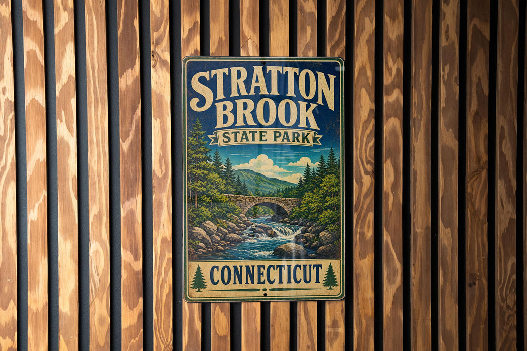 A vintage-style metal sign for Stratton Brook State Park in Connecticut, featuring a scenic landscape with a bridge and waterfall.