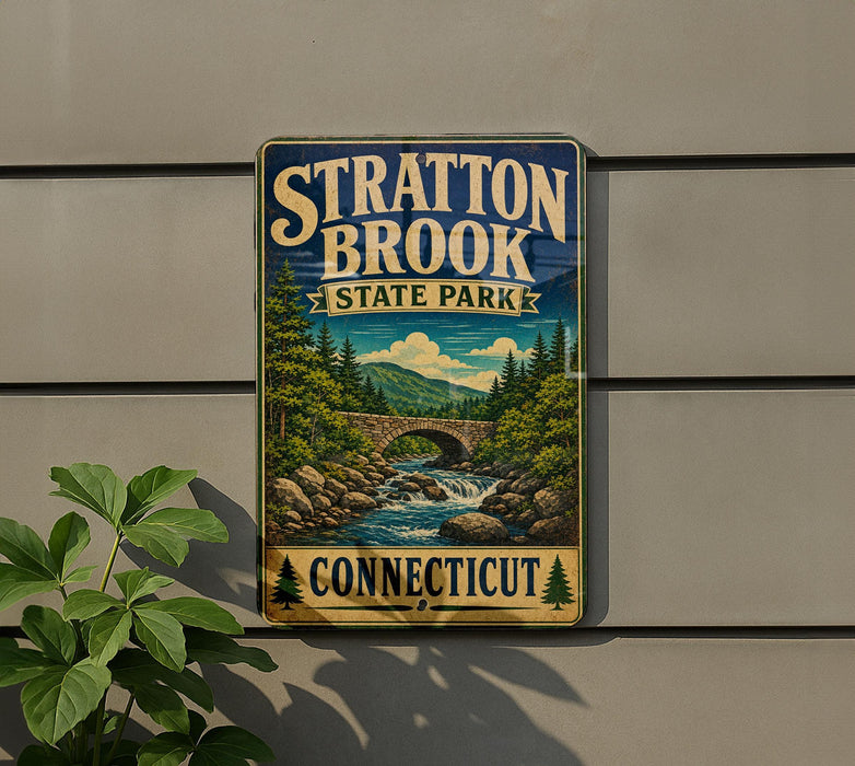 A vintage-style metal sign for Stratton Brook State Park in Connecticut, featuring a scenic landscape with a bridge and waterfall.