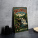 A vintage metal sign for Swallow Falls State Park in Maryland, featuring a scenic waterfall surrounded by lush greenery.