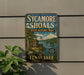 A vintage-style sign for Sycamore Shoals State Historic Park in Tennessee, featuring a scenic illustration of the park and its surroundings.