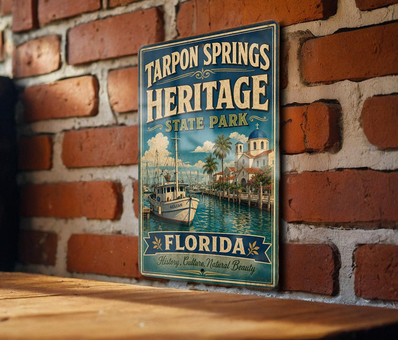 A vintage-style metal sign for Tarpon Springs Heritage State Park in Florida, featuring a boat on a river and a coastal scene.