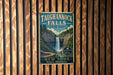 A vintage-style sign for Taughannock Falls State Park, featuring a waterfall and a scenic landscape, is displayed on a wooden wall.