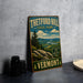 A vintage-style metal sign for Theftord Hill State Park in Vermont, featuring a scenic landscape with mountains, pine trees, and a river.