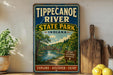 A vintage-style sign for Tippecanoe River State Park in Indiana, featuring a scenic illustration of the river and surrounding landscape.
