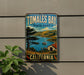 A vintage-style metal sign for Tomales Bay State Park in California, featuring a scenic landscape with a lake, mountains, and a small boat.
