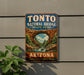A vintage-style sign for Tonto Natural Bridge State Park in Arizona, featuring an illustration of the iconic arch and waterfall.