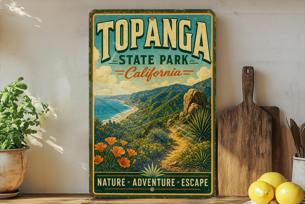 A vintage-style metal sign for Topanga State Park in California, featuring a scenic landscape with mountains, desert, and flowers.