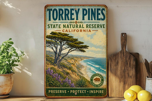A vintage-style sign for Torrey Pines State Natural Reserve in California, featuring a scenic landscape with a pine tree, ocean, and mountains.