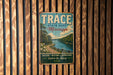 A vintage metal sign for Trace State Park in Mississippi, featuring a scenic image of a river and forest.