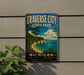 A vintage-style sign for Traverse City State Park in Michigan, featuring a scenic landscape with a beach, cliffs, and a lake.