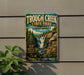 A vintage metal sign for Trough Creek State Park in Pennsylvania, featuring a scenic illustration of a waterfall surrounded by nature.