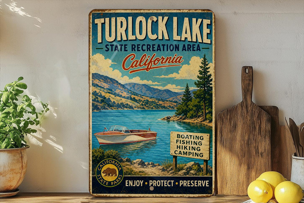 A vintage-style sign for Turlock Lake, California, featuring a scenic image of the lake and mountains, along with text promoting the state recreation area and various outdoor activities.