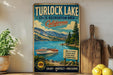 A vintage-style sign for Turlock Lake, California, featuring a scenic image of the lake and mountains, along with text promoting the state recreation area and various outdoor activities.